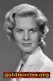 Patricia Cutts come Lt. Peg Whitcomb