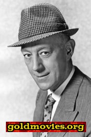 Alec Guinness come John Barratt / Jacques De Gue