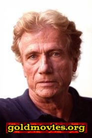 Jürgen Prochnow come Maxwell Dent