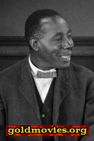 George H. Reed come Black Man Giving Booth Directions