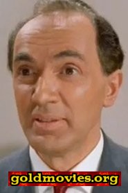 Andre Charisse come T.V. Newscaster